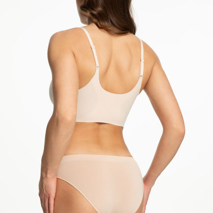 pieguļošs bezvīļu krūšturis, miesas krāsas, sānskats no aizmugures